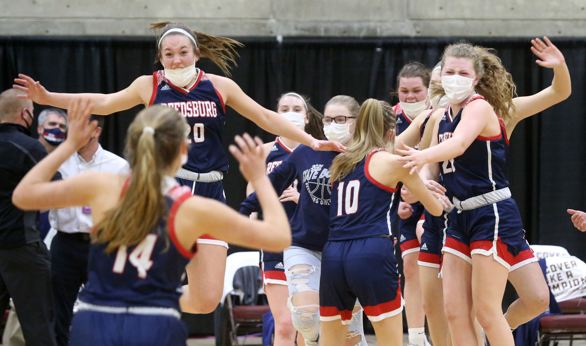 WIAA state girls basketball photo: Victorious Reedsburg players jump for joy